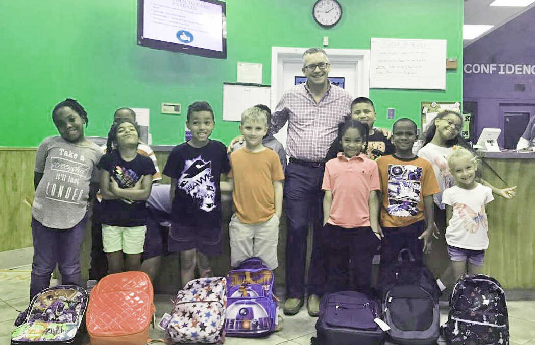 Smith Brothers Insurance Donates Backpacks To Help Children Start Their School Year