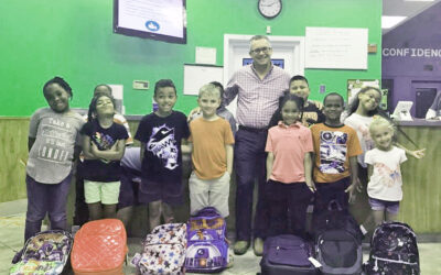 Smith Brothers Insurance Donates Backpacks To Help Children Start Their School Year
